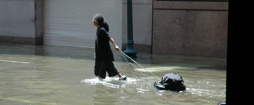 A photograph of a refugees in water