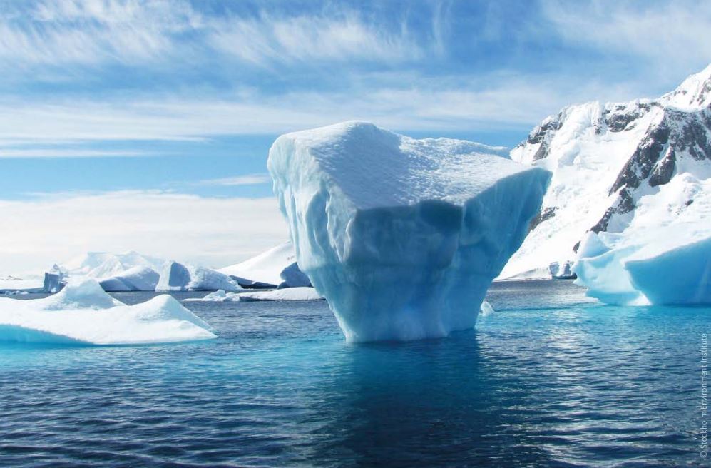 Piece of iceberg floating on a turquoise sea