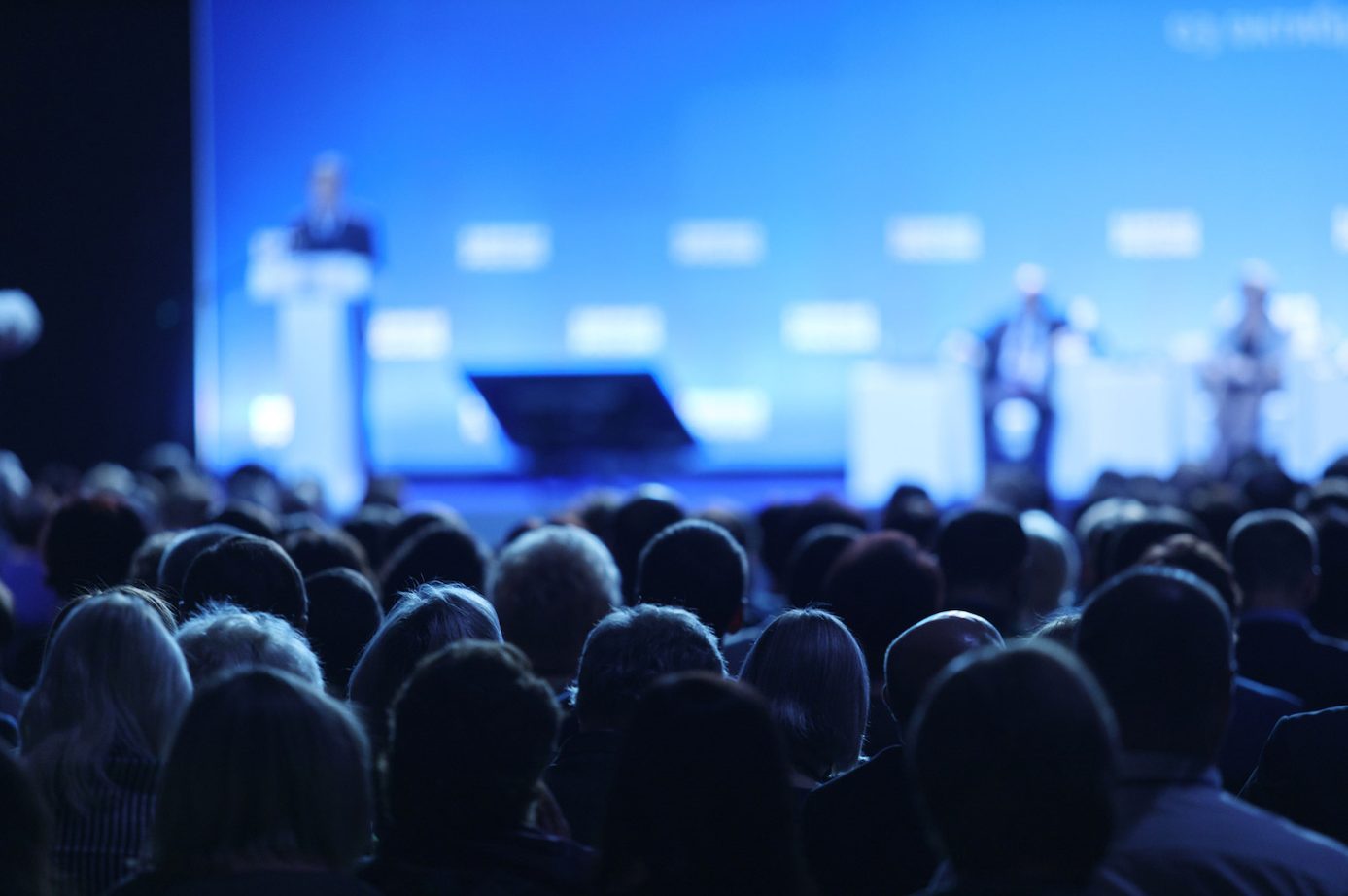 Crowd of people attending a conference