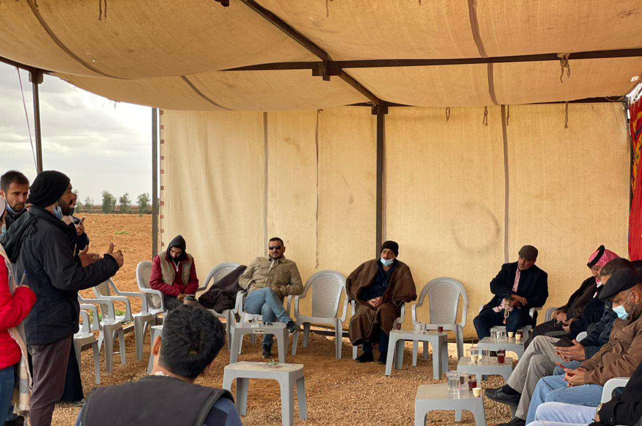 People under a tent discussing around the MAR project