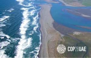 Aerial view of a river meeting the ocean