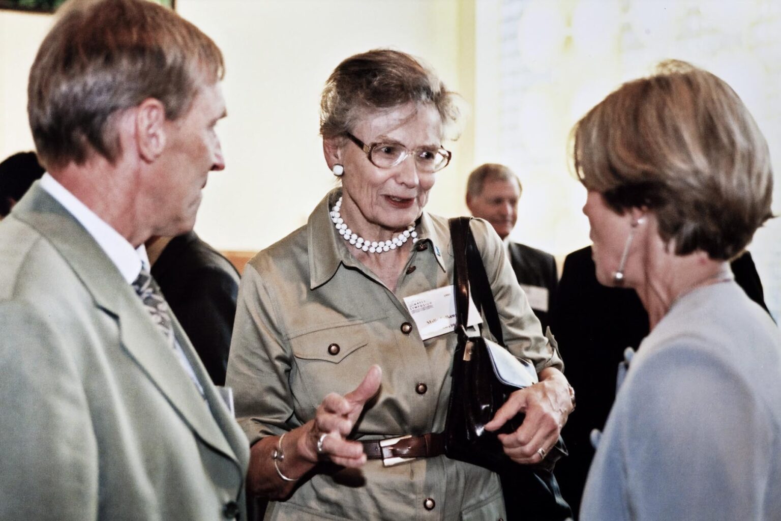 Malin Falkenmark talking with 2 other people from the back in 2000