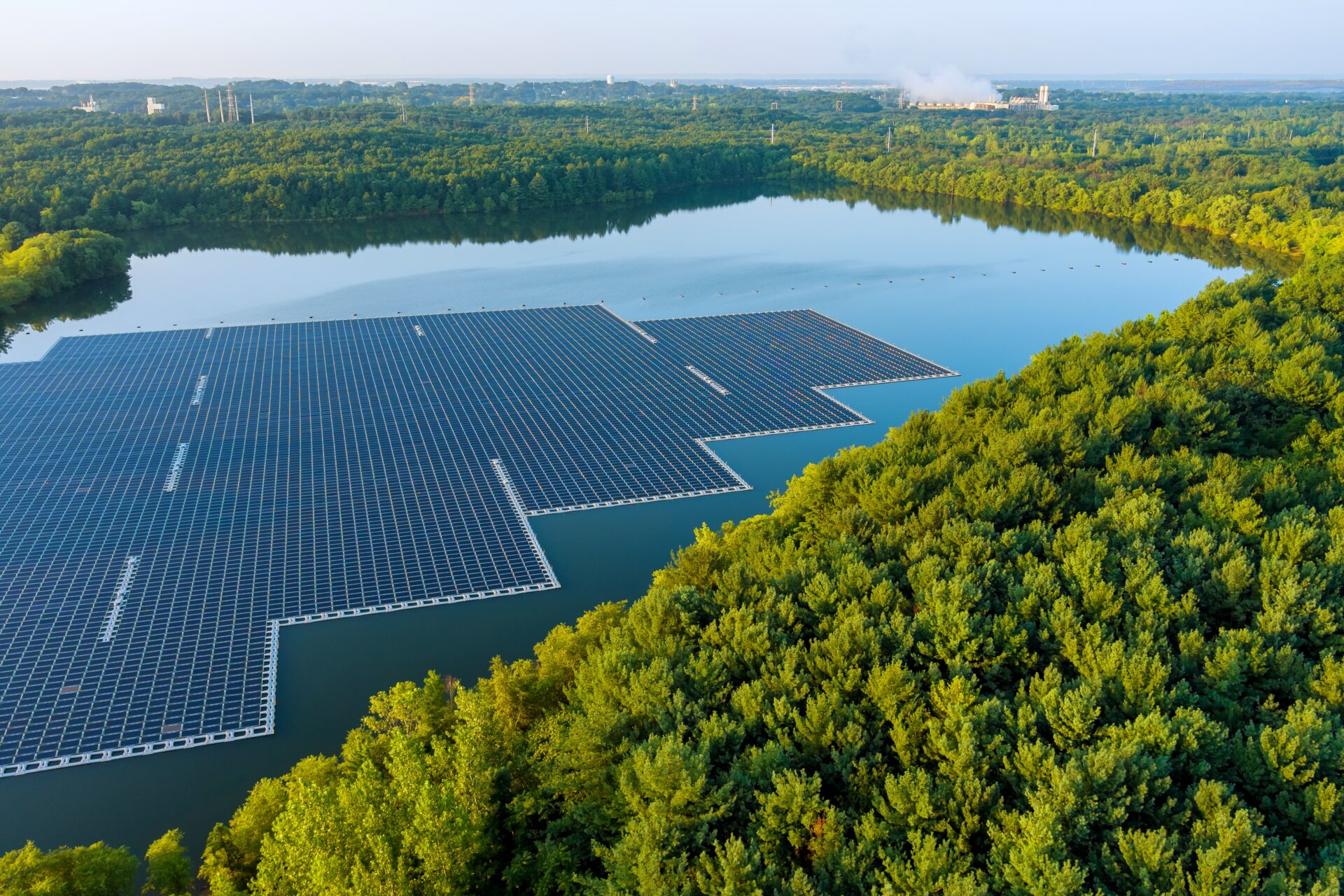 Aerial top view of environmentally friendly energy with floating solar panels platform system on the lake